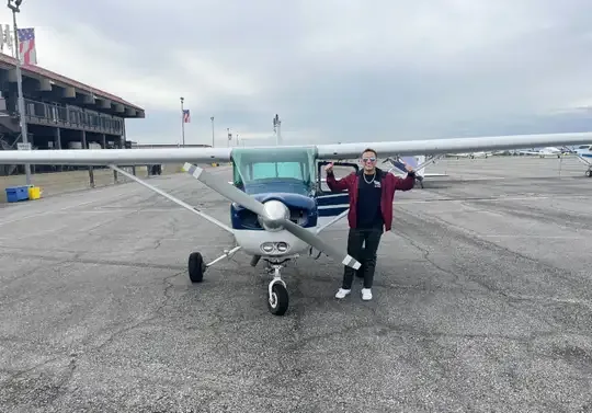 Detail shot of a student pilot completing the checkride process with their CFI at Riverside Municipal Airport
