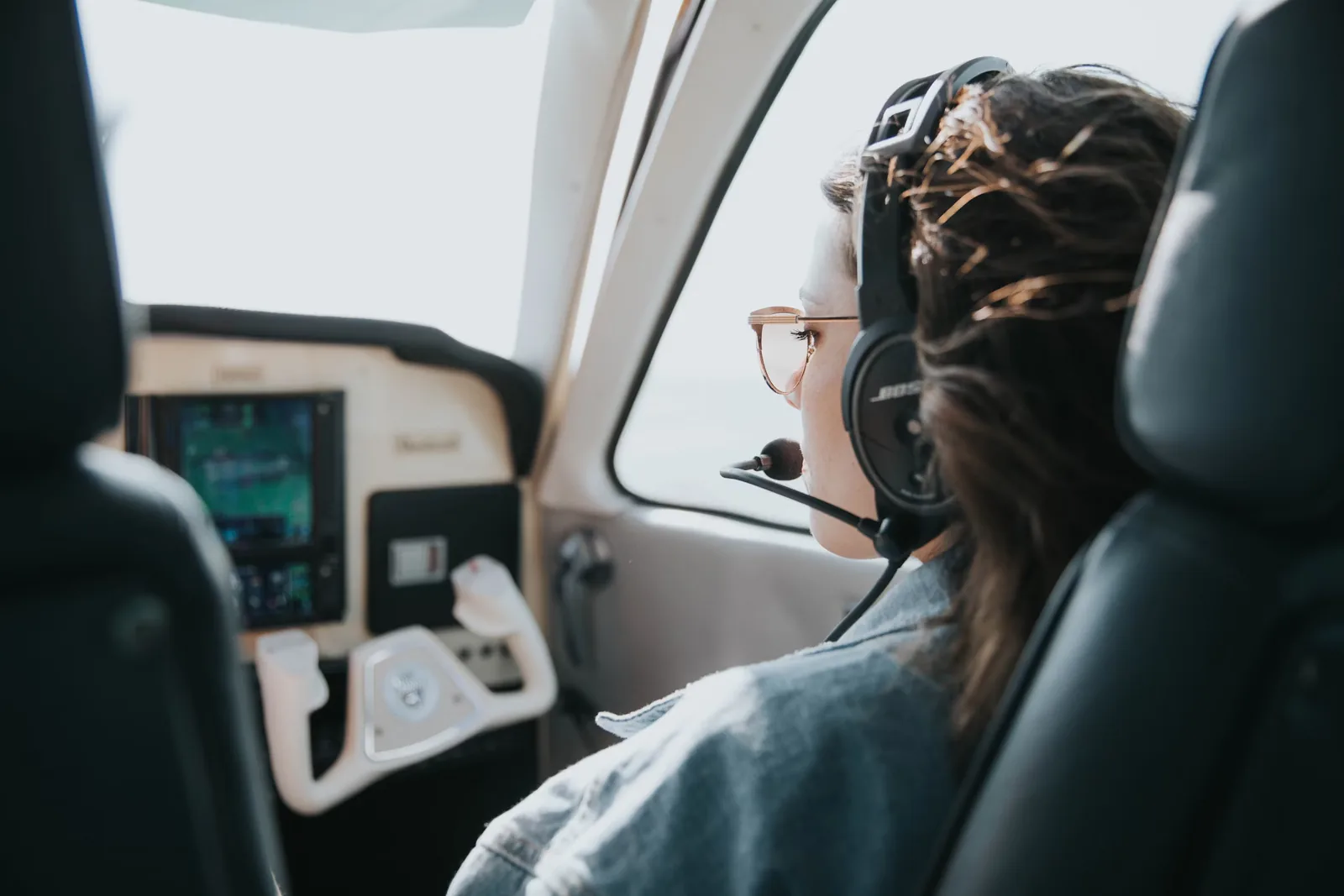 Student pilot in a training aircraft considering career paths in commercial aviation