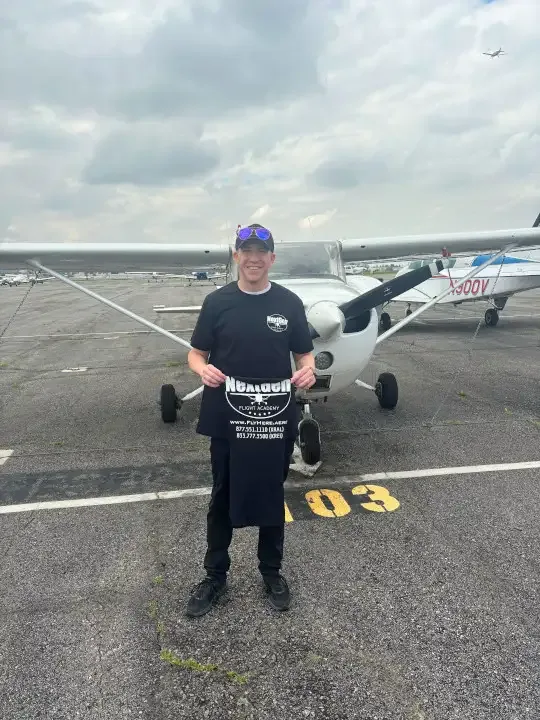 Student pilot performing a preflight inspection before a training flight